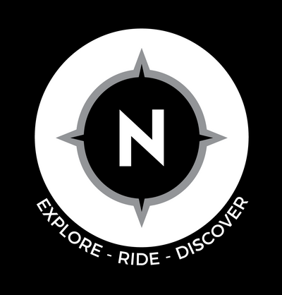 Logotipo de NOMAD Motociclismo.