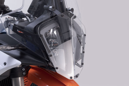 SW-MOTECH Protección de faros Soporte con embellecedor. KTM 890 Adv. R (22-).