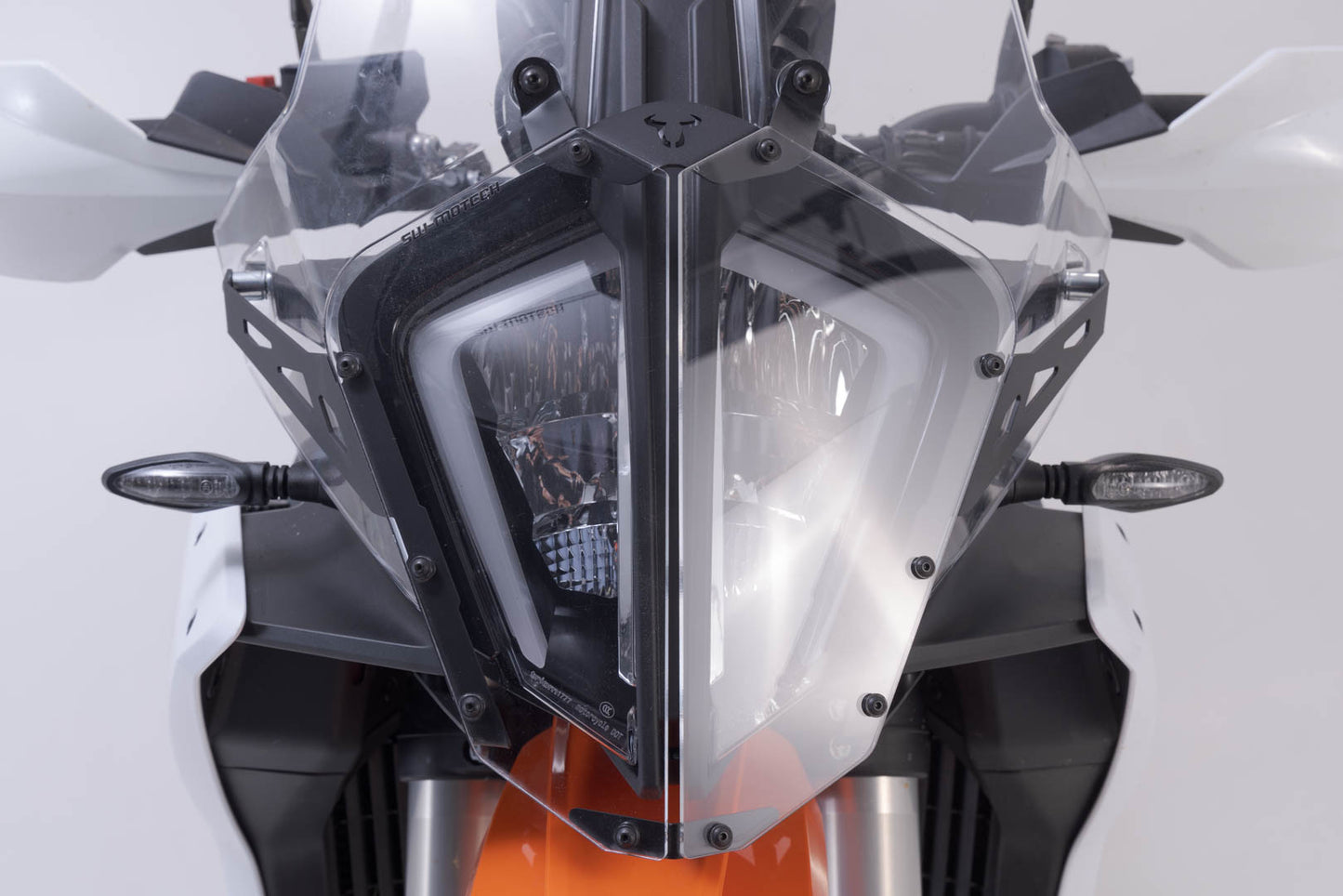SW-MOTECH Protección de faros Soporte con embellecedor. KTM 890 Adv. R (22-).